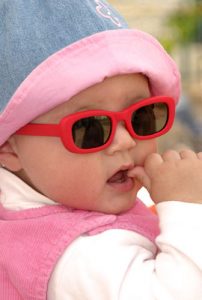 baby in red glasses